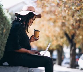African american woman working on a computer outdoors